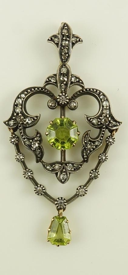 A Victorian gold and silver, peridot and diamond cluster set articulated drop pendant